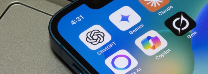 A smartphone on a keyboard with AI icons visible showing applications like ChatGPT amongst others. 