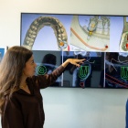 Two faculty members demonstrate AI in dentistry applications. 