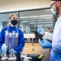 Students participate in 100 level chemistry labs in the Natural Sciences Complex in October 2020. Students demonstrate proper use of face coverings and other PPE while working in a research lab, in keeping with current guidelines. 