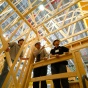 Image of students standing in an architectural structure. 