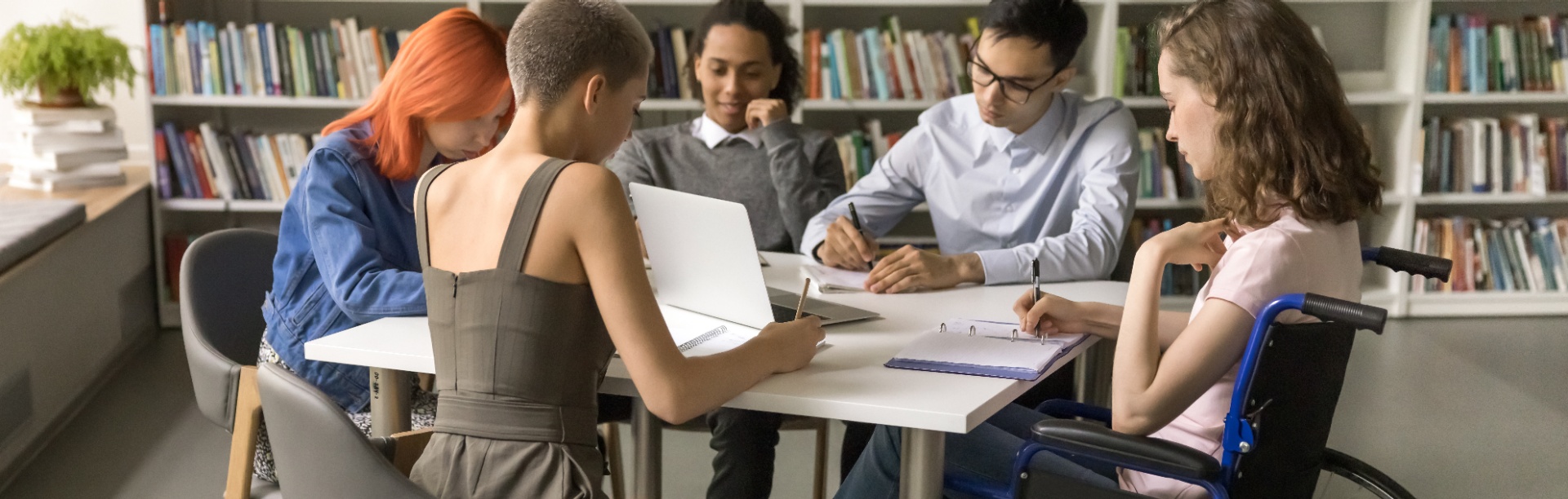 A group of students studying in a library.