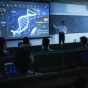 Instructor using technology for a lecture in a classroom. 