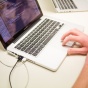 Image of a laptop computer with code on the screen. 