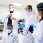 Faculty member teaching a group of biomedical engineering students. 