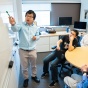 Shi Li, with the School of Engineering and Applies Sciences (SEAS) Computer Science and Engineering, speaks with students in his lab in Davis Hall in May 2019. Li's research if in theoretical computer science. 
