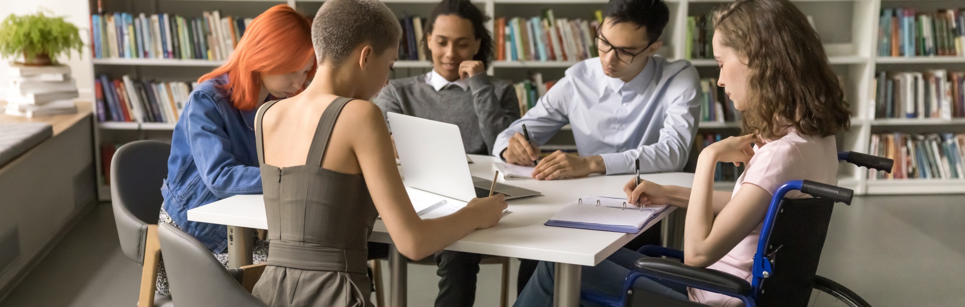 A group of students studying in a library.