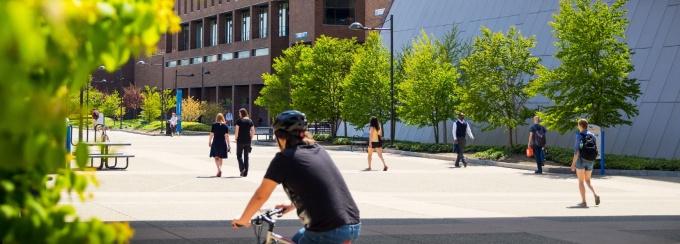 Students walking near North Campus buildings in the Spring. 