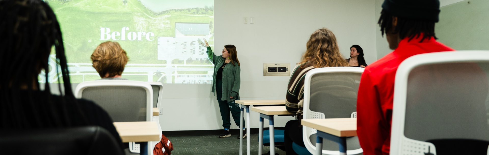 Students present their sustainable communities projects in a UB Libraries classroom. 