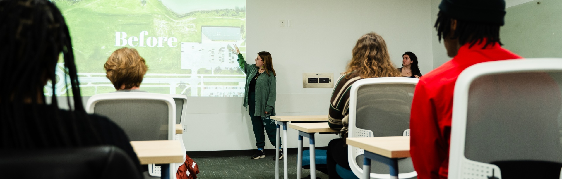 Students present their sustainable communities projects in a UB Libraries classroom.