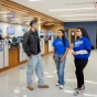 Students chat inside the 1Capen office in Capen Hall. 