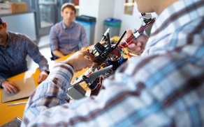 faculty member demonstrating a drone. 