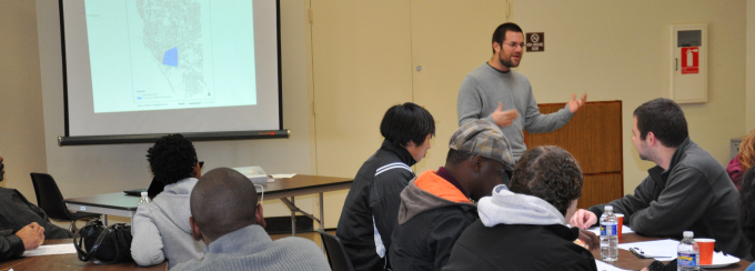 Students listening to a presentation. 