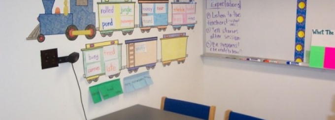 Zoom image: Tutoring carrel of a first grader who is learning to read and write lots of vocabulary words. 