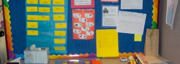 Zoom image: Tutoring carrel of a second grader. The clinicians and child spend time every tutoring session solidifying his knowledge of common ending sounds and letters. 