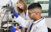 Mustafa Ignatowski Pharm Tox student in lab with mentor. 