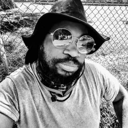 A spoken word artist from Buffalo, NY uses the stage name Legendary the Poet. This individual is known for independently authoring 10 books and has served the poetry scene for 13 years. They have also been nominated for three awards, two local and one national, and have been internationally published in the UK. Beyond their artistic work, they also mentor, advocate for, and teach about their disability, Cerebral Palsy. They have performed at events celebrating the American Disabilities Act in their hometown. 