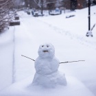 A snow figure outside Davis Hall in Grace Plaza. 