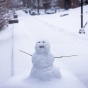 A snow figure outside Davis Hall in Grace Plaza. 