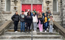 Members of UB's Daniel Acker scholars program and Pilgrim St. Luke's Church in Buffalo on the front steps of the church. 