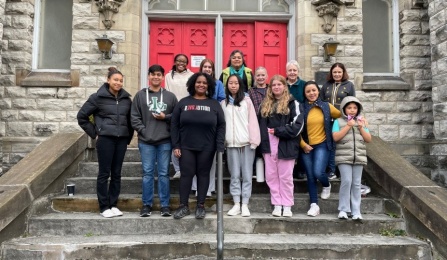 Members of UB's Daniel Acker scholars program and Pilgrim St. Luke's Church in Buffalo on the front steps of the church. 