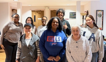 A group of Acker Scholars and representatives from St. Luke's Church pose for a group picture. 