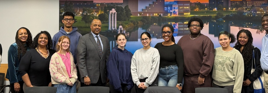 Acker Scholars and staff pose for a picture with Dean Alford. 