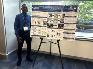 Student presenting research at the Summer Research Symposium. 