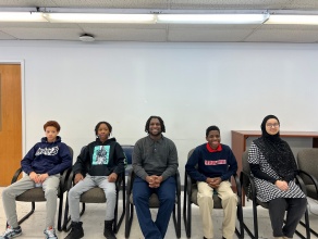 6 students seated. 