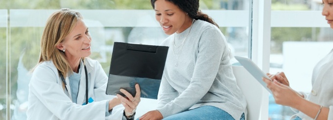 Doctor and patient looking at a file. 