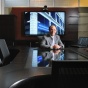 Photo of IHI Executive Director Peter Winkelstein, MD, MS, MBA, in a board room. 