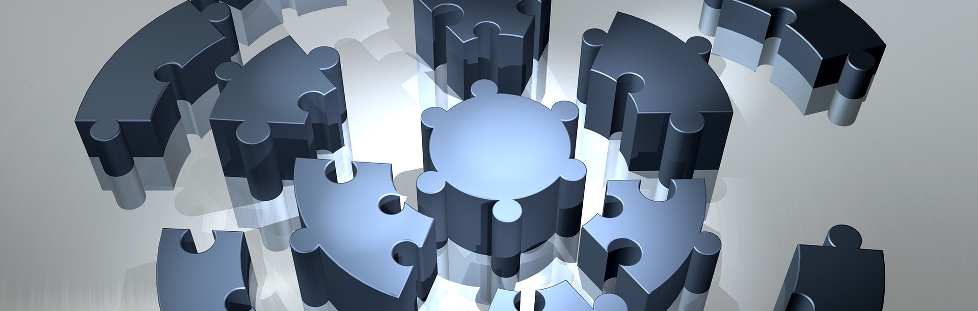 A 3-D graphic of puzzle pieces in the process of forming a circle. 