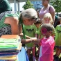 Photo of a woman helping a small child at Canalside in Buffalo. 