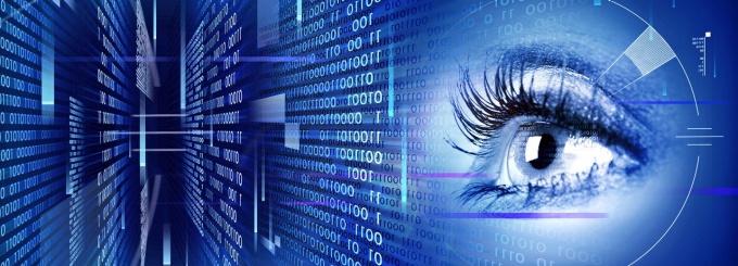 human eye overlaid with biometric measurements and computer code. 