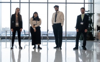 UB students dressed in business attire and ready to work. 