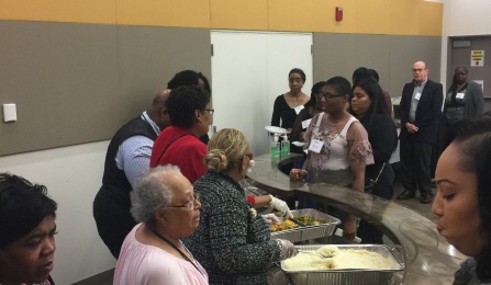 Reception Dr. Julius Adams and EOC Faculty Serving food. 