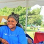 Alumna assists with sign-in at Buffalo Juneteenth Festival. 