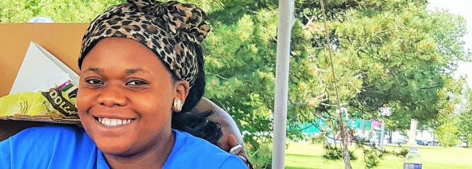 Alumna assists with sign-in at Buffalo Juneteenth Festival. 