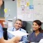 Medical Billing and Coding Specialists smiling. 