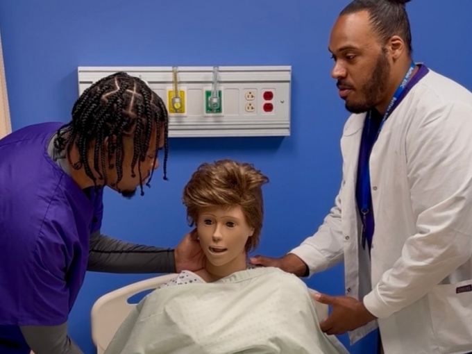 Certified Nurse Assistant assisting a patient. 