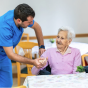 PCA (Personal Care Assistant) helping a person. 