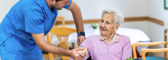 PCA (Personal Care Assistant) helping a person. 