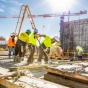 Construction workers on a concrete form. 