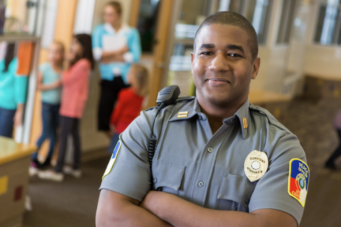smiling security guard in a school. 