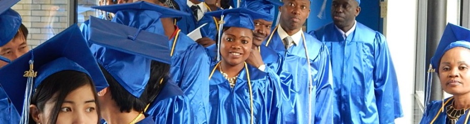 This is a picture of a group of people wearing business attire standing next to each other. 