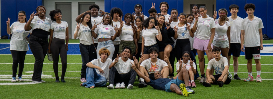 A large group of students and counselors standing together during the Summer Bridge program.