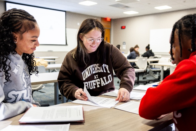 Students working together in a classroom. 