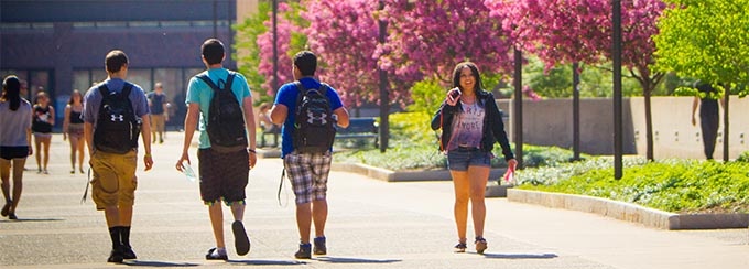 Students walking outside on the academic spine on the North Campus. 