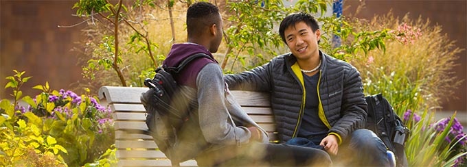 Students on North Campus with autumn foliage. 