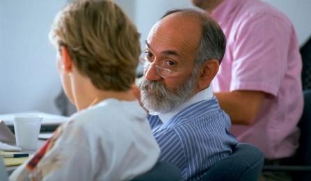 Two faculty members talking. 