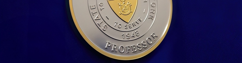 an image of the suny distinguished medal, a gold and silver medallion. 